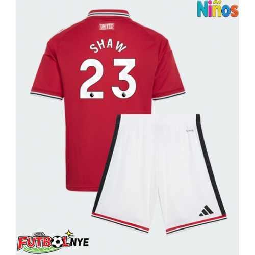 Camiseta Manchester United Luke Shaw #23 Primera Equipación para niños 2026-27 manga corta (+ pantalones cortos)